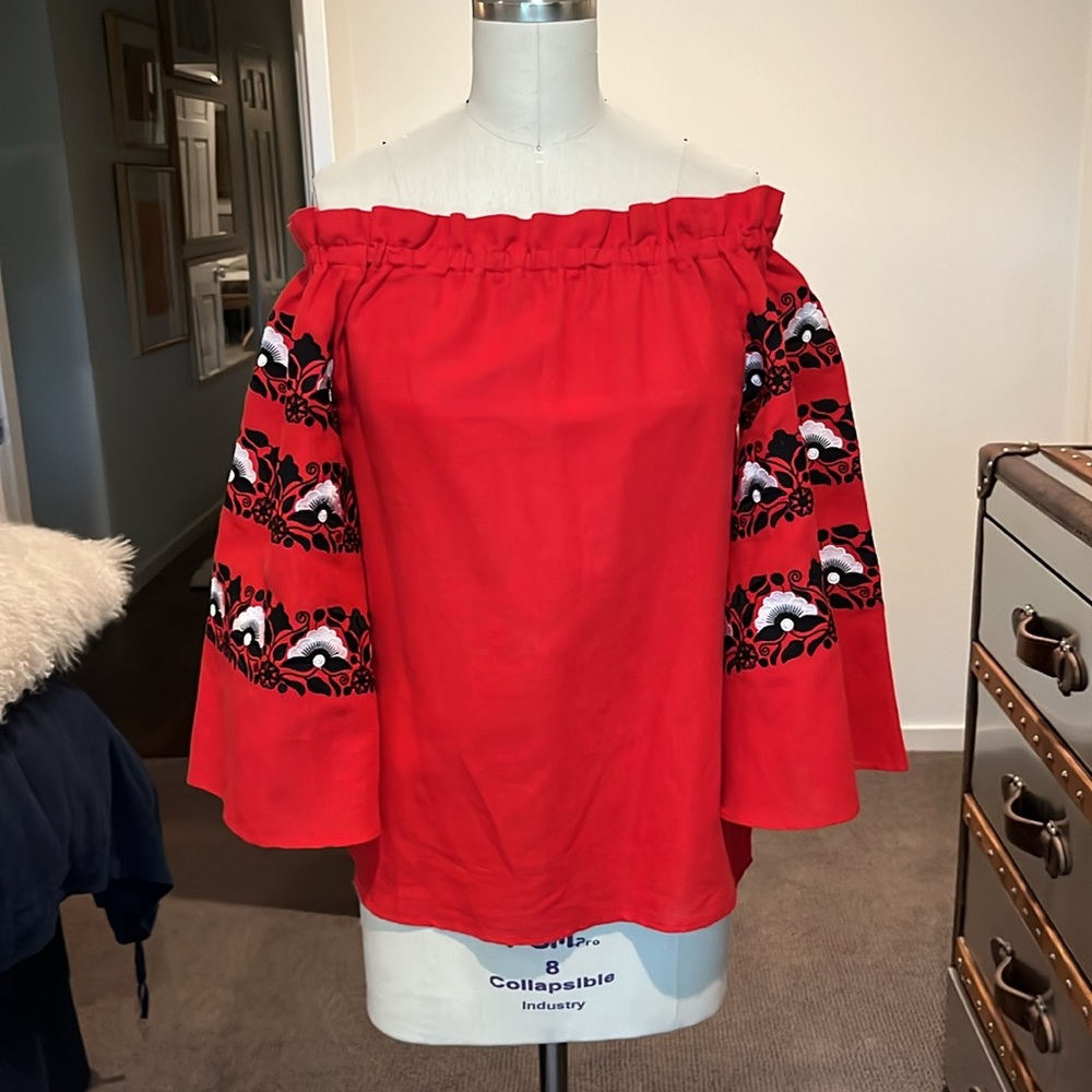 La Zuli red linen off-the-shoulder top with floral embroidery on sleeves